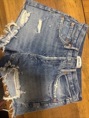 Agolde Distressed Medium Blue Denim Cutoff Shorts